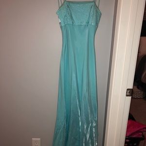 Light blue strapless formal gown.